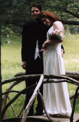 Standing on one of the branch-bridges that decorate the walkways, during our wedding photos.  (Note the belly... we found out just two weeks after mailing out the invitations!)